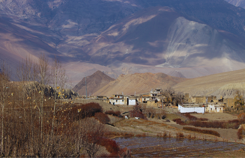 Traditional stone houses and Buddhist chortens seen along the Damodar Kunda Upper Mustang trekking route