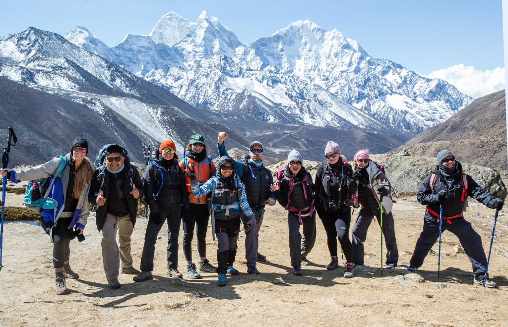 Trekker in Everest Base Camp surrounded by snow-capped peaks in the Himalayas, Nepal