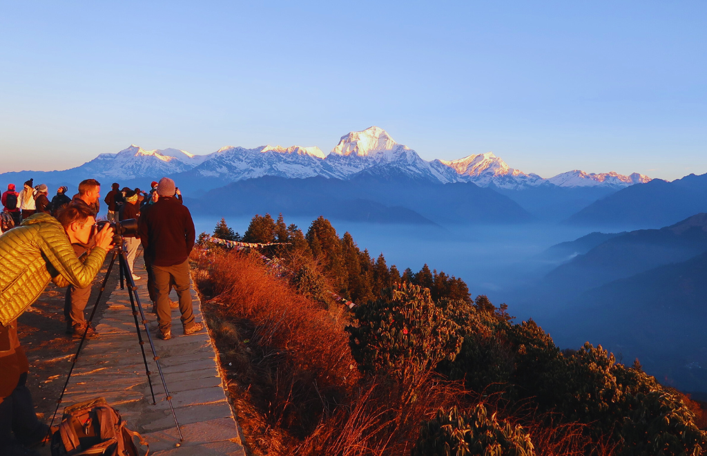 Golden sunrise view over Annapurna and Dhaulagiri ranges from Poon Hill viewpoint, Nepal