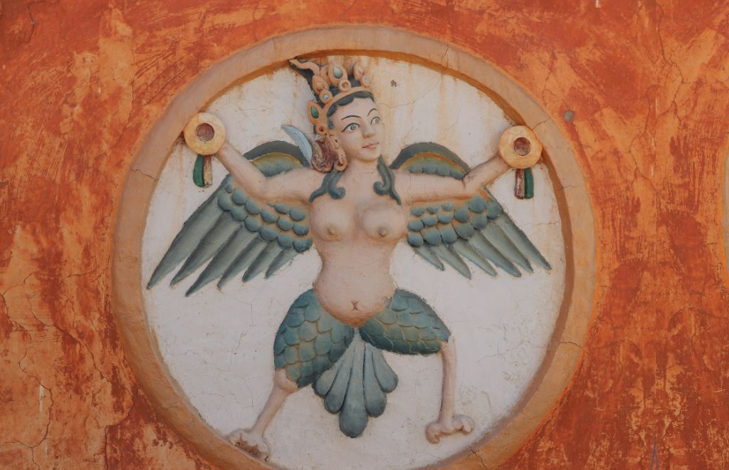 Religious motif carved on the wall of an ancient monastery in Upper Mustang, Nepal